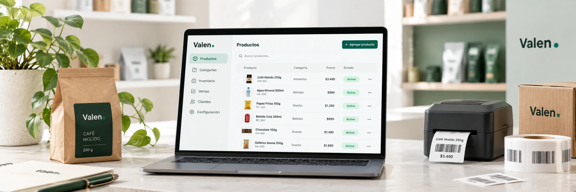 Notebook con el catálogo de Productos de Valen abierto junto a una impresora de etiquetas y productos reales sobre el mesón